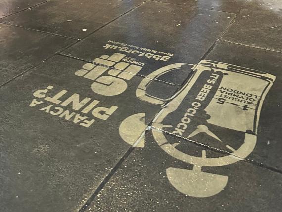 Fancy a Pint? Clean Graffiti stencilled logo on pavement