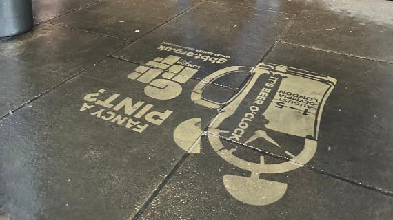 Fancy a Pint? Clean Graffiti stencilled logo on pavement