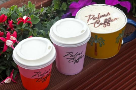 Palms coffee branded cups and coffee stencilled with chocolate powder