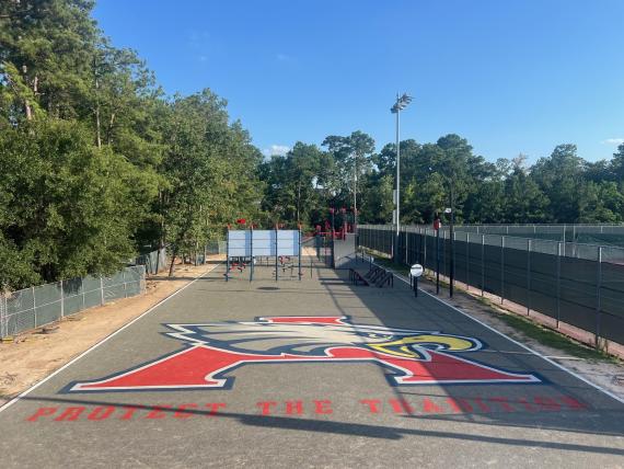 Playground stencils applied on a basketball court with Eagle logo