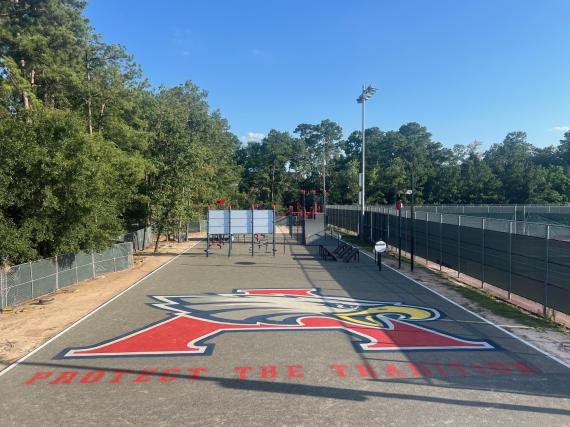 Playground stencils applied on a basketball court with Eagle logo