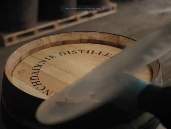 Stencil being removed to reveal the Inchdairnie Distillery brand on a whisky cask