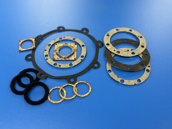 Laser cut gaskets on blue background