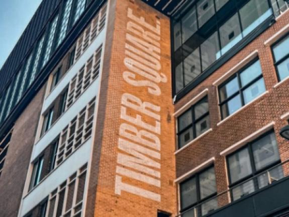 Timber Square logo stencilled on historic brickwork for Lucas UK