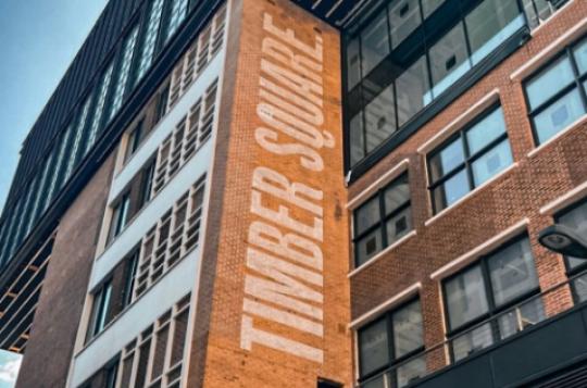 Timber Square logo stencilled on historic brickwork for Lucas UK