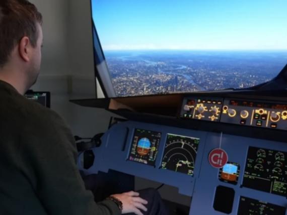 View over pilot's shoulder looking out the window of an A320 flight simulator
