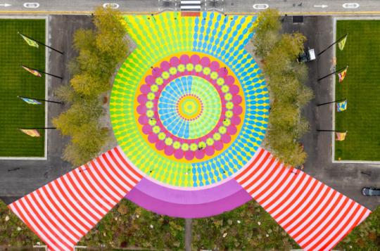 Overhead view of large mural installation using stencils