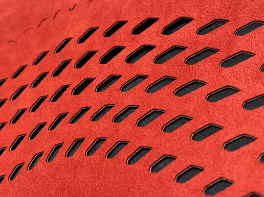 Red laser cut fabric for McLaren