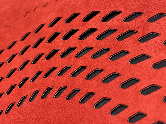 Red laser cut fabric for McLaren