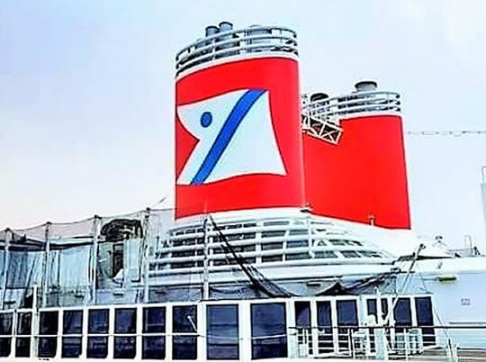 Funnel of MS Borealis stencilled with extra large logo in red, blue and white
