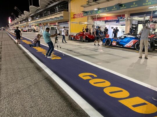 Pit lane logos applied on race track using extra large stencils supplied by Laser Cut It