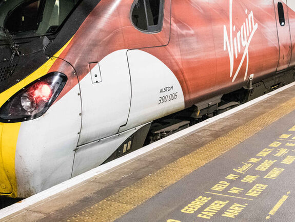 Completed Virgin Trains Christmas Campaign with words painted through stencils onto platform
