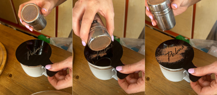 Stencilling a logo onto coffee with chocolate powder
